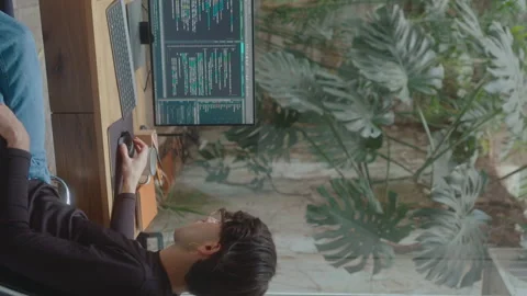 IT Developer Scrolling through Computer Code on PC Stock Footage 252754430