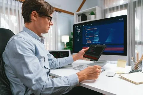 IT developer selecting by point on coding online software. Pecuniary. Stock Photos