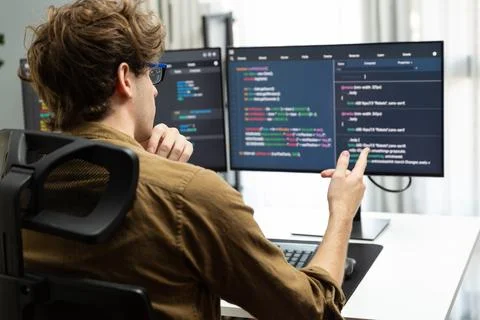 IT developer with stressful overworked in creating online software code. Gusher. Foto stock