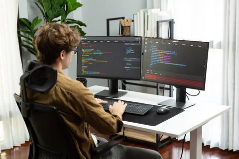 IT developer with stressful overworked in creating online software code. Gusher. Stock Photos