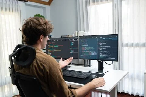 IT developer with stressful overworked in creating online software code. Gusher. Stock Photos