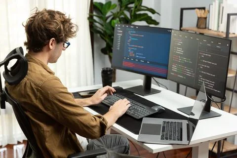 IT developer with stressful overworked in creating online software code. Gusher. Stock Photos