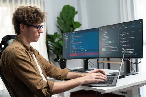 IT developer with stressful overworked in creating online software code. Gusher. 写真素材