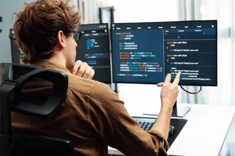 IT developer with stressful overworked in creating online software code. Gusher. Stock Photos