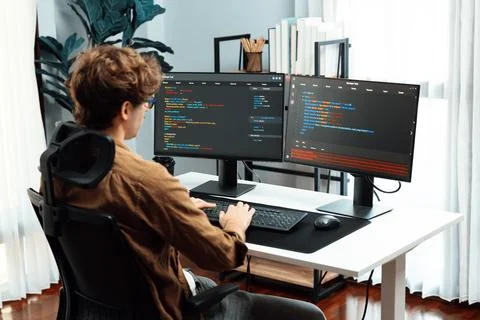 IT developer with stressful overworked in creating online software code. Gusher. Stock Photos