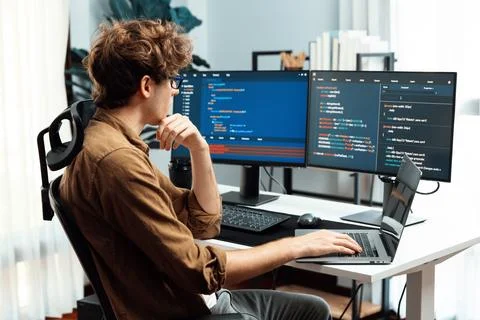 IT developer with stressful overworked in creating online software code. Gusher. Stock Photos