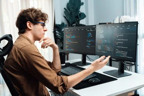 IT developer with stressful overworked in creating online software code. Gusher. Stock Photos