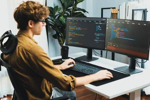 IT developer with stressful overworked in creating online software code. Gusher. 写真素材