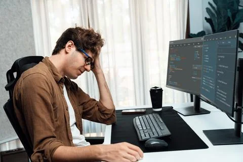 IT developer with stressful overworked having headache in bad feeling. Gusher. Stock Photos