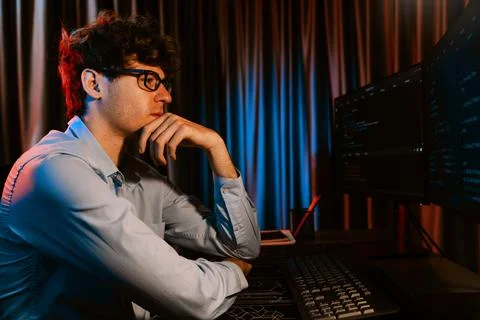 IT developer thinking online software information coding on pc screen. Gusher. Stock Photos