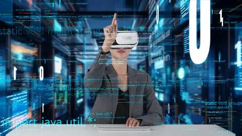 IT developer typing computer code for analyzing intelligent by VR. Contraption. Foto stock