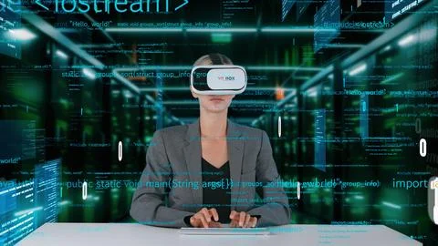 IT developer typing computer code for analyzing intelligent by VR. Contraption. Foto stock