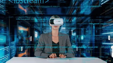 IT developer typing computer code for analyzing intelligent by VR. Contraption. 写真素材