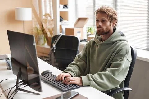 IT Developer Using Computer and Typing Working in Office Stock Photos