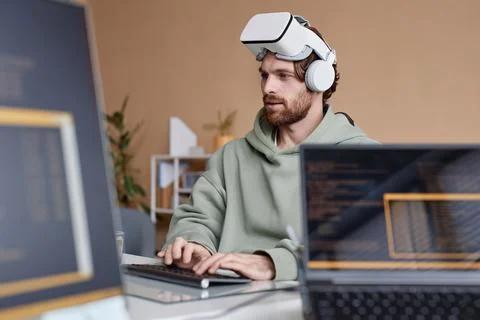 IT Developer Wearing Vr Headset Working on Immersive Technology in Office Stock Photos