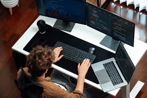 IT developer working online development on pc monitors on top view. Gusher. 스톡 사진