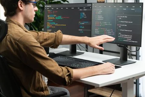 IT developer working online software development coding on pc screens. Gusher. 스톡 사진