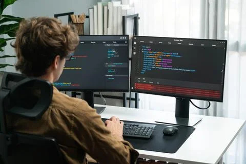 IT developer working online software development coding on pc screens. Gusher. 스톡 사진