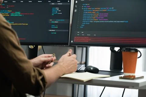 IT developer working online software development coding on pc screens. Gusher. 스톡 사진