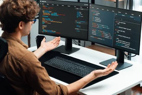 IT developer working online software development coding on pc screens. Gusher. 스톡 사진