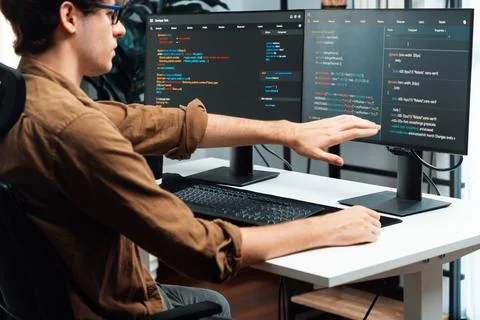 IT developer working online software development coding on pc screens. Gusher. 스톡 사진