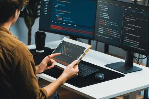 IT developer working online software development coding on pc screens. Gusher. 스톡 사진