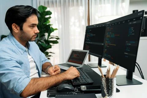 IT developer writing data memo software development on paper's coding. Surmise. 스톡 사진