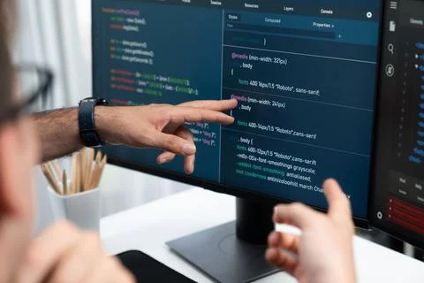 IT developers creating online software development information. Sellable. Stock Photos