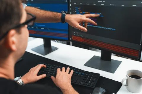 IT developers creating online software development information. Sellable. Stock Photos