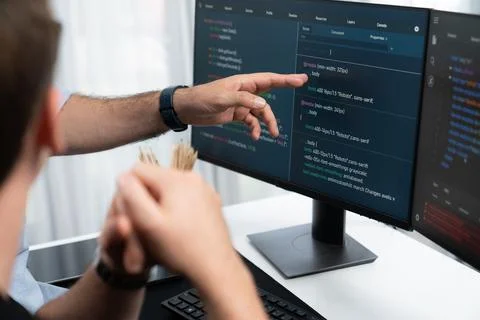 IT developers creating online software development information. Sellable. Stock Photos