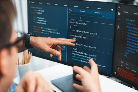 IT developers creating online software development information. Sellable. Stock Photos