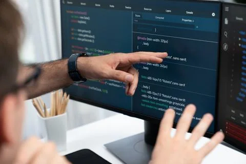 IT developers creating online software development information. Sellable. Stock Photos