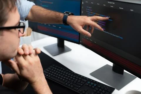 IT developers creating online software development information. Sellable. Stock Photos