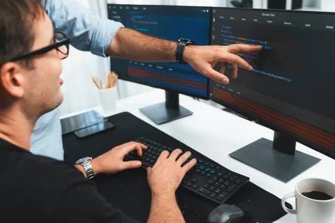 IT developers creating online software development information. Sellable. Stock Photos