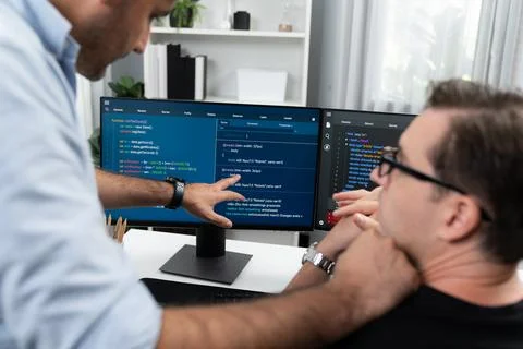 IT developers creating online software development information. Sellable. Stock Photos