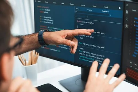 IT developers creating online software development information. Sellable. Stock Photos