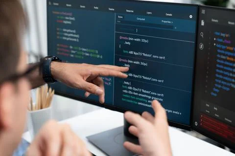 IT developers creating online software development information. Sellable. Stock Photos