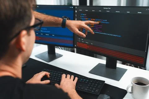 IT developers creating online software development information. Sellable. Stock Photos