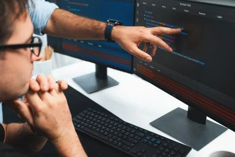 IT developers creating online software development information. Sellable. Stock Photos