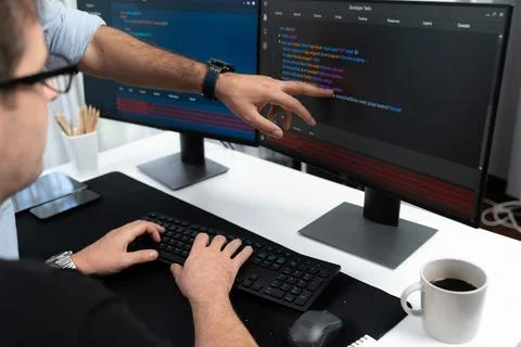 IT developers creating online software development information. Sellable. Stock Photos