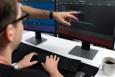 IT developers creating online software development information. Sellable. Stock Photos