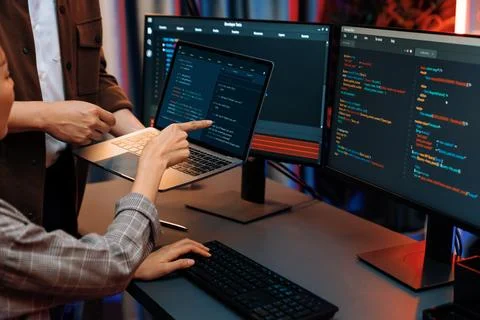 IT developers discussing intelligent website with laptop showing data. Infobahn. Stock Photos