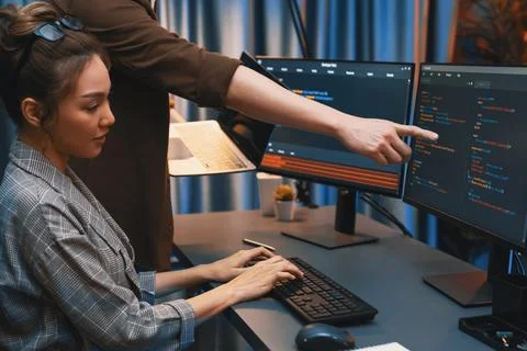 IT developers discussing intelligent website with laptop showing data. Infobahn. Stock Photos