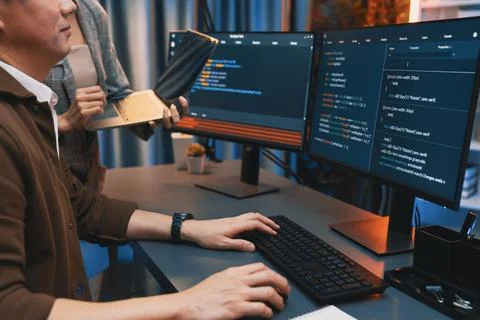 IT developers discussing intelligent website with laptop showing data. Infobahn. Stock Photos