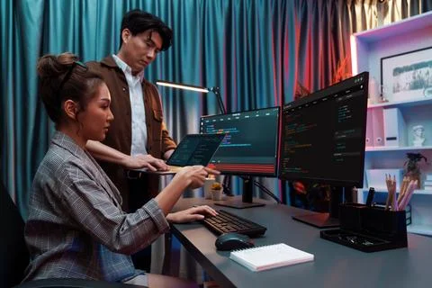 IT developers discussing intelligent website with laptop showing data. Infobahn. Stock Photos