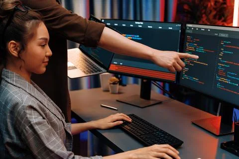 IT developers discussing intelligent website with laptop showing data. Infobahn. Stock Photos