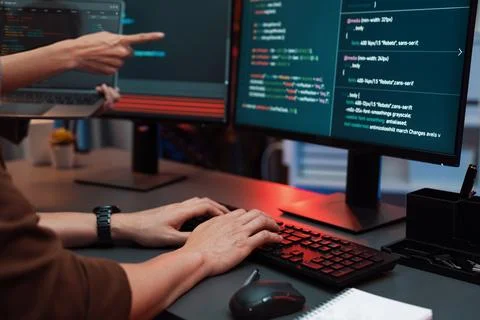 IT developers discussing intelligent website with laptop showing data. Infobahn. Stock Photos