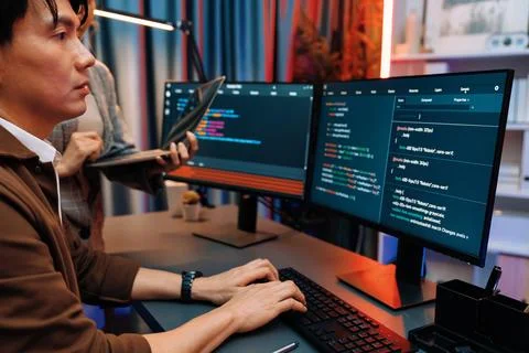 IT developers discussing intelligent website with laptop showing data. Infobahn. Stock Photos