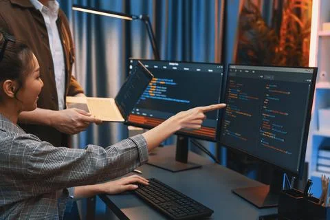 IT developers discussing intelligent website with laptop showing data. Infobahn. Stock Photos