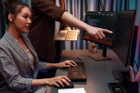 IT developers discussing intelligent website with laptop showing data. Infobahn. Stock Photos